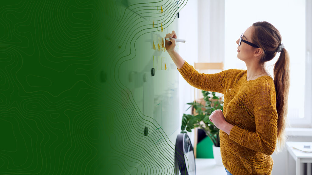 Woman brainstorming at whiteboard