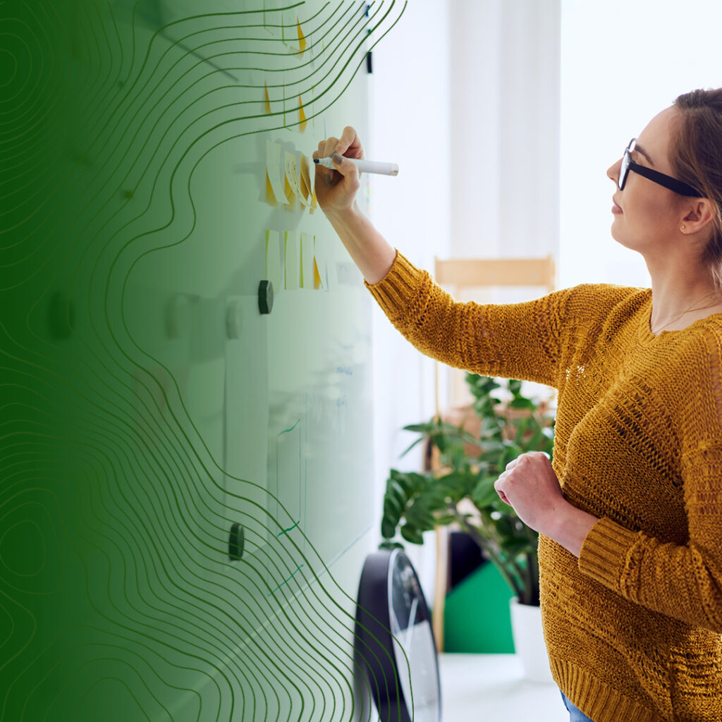Woman brainstorming at whiteboard